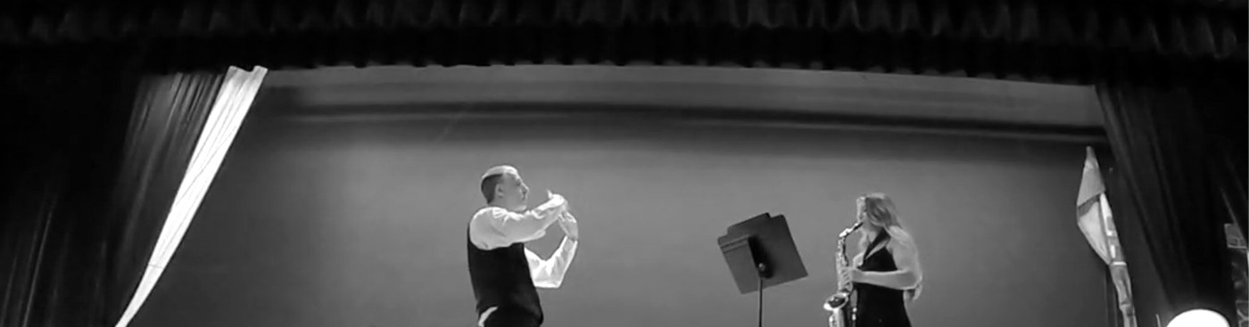 Saxophone soloist on stage with Mr. Brown conducting